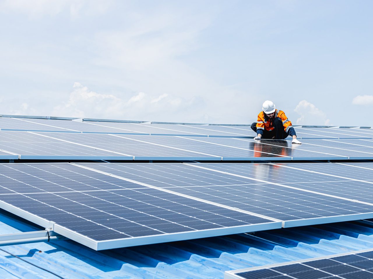 Huronis technician installing solar panels